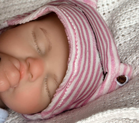 head of a reborn doll girl made of silicone very realistic