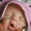 mouth open and head of a reborn doll girl made of silicone very realistic